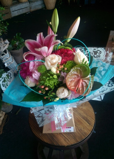 Variety Show - A fabulous collection of lilies, roses, anthurium, blooms and berries with seasonal fillers