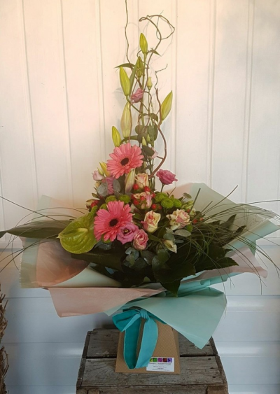 You're Beautiful - Wow them with this stunning design created by Emma Dandy of Flowers of Kidderminster.

This structured arrangement contains Pink Gerbera, Rose, Eustoma and Anthurium set with lush green foliage, delivered in a box finished with a bow.

Emma has created the 'Fine & Dandy' collection of arrangement designs for when something truly stunning, beautiful and unique is required!

Created in the shop on Lisle Avenue with the freshest stems, Emma and her team will create this arrangement ready for collection or delivery.

Final arrangement may look different to the image and stems may be substituted when necessary but your arrangement will alway look stunning! The container is subject to availability and may be substituted.

Almost what you're after? We can tailor any bouquet to your needs and budget. Want to incorporate their favourite colours? Do you want to adapt the style to your needs and budget? All colours, styles and budgets can all be catered for.

Arrangements are available for same day delivery, when ordered before 2pm, in Kidderminster and the surrounding area. (Charges apply)