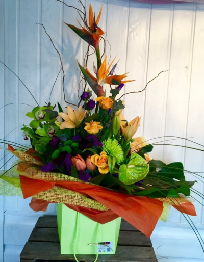 Lime Dream - This Lime, Orange and Purple 'Fine & Dandy' creation by Emma Dandy of Flowers of Kidderminster, incorporates green Cymbidium, Orchid, Tropical Strelitzia, purple Eustoma and lime Santini.

Emma has created the 'Fine & Dandy' collection of arrangement designs for when something truly stunning, beautiful and unique is required!

Created in the shop on Lisle Avenue with the freshest stems, Emma and her team will create this arrangement ready for collection or delivery.

Final arrangement may look different to the image and stems may be substituted when necessary but your arrangement will alway look stunning! The container is subject to availability and may be substituted.

Almost what you're after? We can tailor any bouquet to your needs and budget. Want to incorporate their favourite colours? Do you want to adapt the style to your needs and budget? All colours, styles and budgets can all be catered for.

Arrangements are available for same day delivery, when ordered before 2pm, in Kidderminster and the surrounding area. (Charges apply)