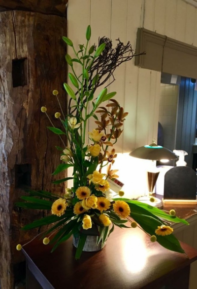 Lovely Lemon - This 'Fine & Dandy' creation by Emma Dandy of Flowers of Kidderminster, incorporates lemon Asiatic Lily, lemon Rose, Germini, Cymbidium Orchid, Alstroemerias, Craspidia and Willow.

This beautiful arrangment is perfect for any occasion when something beyond the ordinary is required!

Emma has created the 'Fine & Dandy' collection of arrangement designs for when something truly stunning, beautiful and unique is required!

Created in the shop on Lisle Avenue with the freshest stems, Emma and her team will create this arrangement ready for collection or delivery.

Final arrangement may look different to the image and stems may be substituted when necessary but your arrangement will alway look stunning! The container is subject to availability and may be substituted.

Almost what you're after? We can tailor any bouquet to your needs and budget. Want to incorporate their favourite colours? Do you want to adapt the style to your needs and budget? All colours, styles and budgets can all be catered for.

Arrangements are available for same day delivery, when ordered before 2pm, in Kidderminster and the surrounding area. (Charges apply)