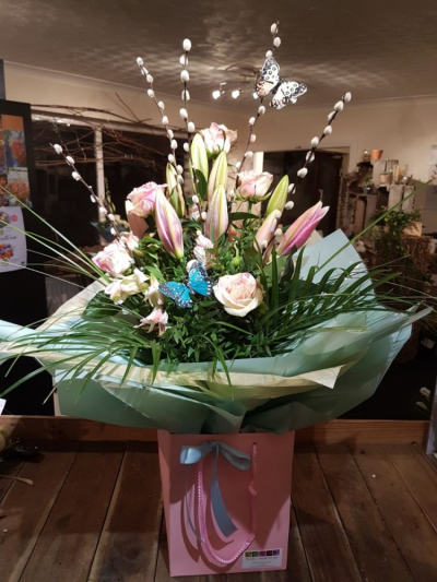 Perfect Birthday - Inspired by nature in whites and subtle pinks set within fresh green foliage and pussy willow with butterfly decorations, handtied and presented in a gift box with ribbon.

A wonderful clean, fresh looking bouquet of Roses and Lilies.

Each bouquet is designed and created by the talented florists at Flowers of Kidderminster. Professional, qualified, local florists, Emma and her team add a touch of pizazz and style to every bouquet. Every arrangement is put together by hand, from scratch, from the wide selection of beautiful fresh flowers here in our shop on Lisle Avenue.

Almost what you're after? We can tailor any bouquet to your needs and budget. Want to incorporate their favourite colours? Do you want to adapt the style to your needs and budget? All colours, styles and budgets can all be catered for.

All flowers are subject to availability. Substitutes may be used but your bouquet will always look beautiful!

Order this item before 2pm for same day delivery by Flowers of Kidderminster in Kidderminster and surrounding areas.

Available for delivery on any day of your choice.