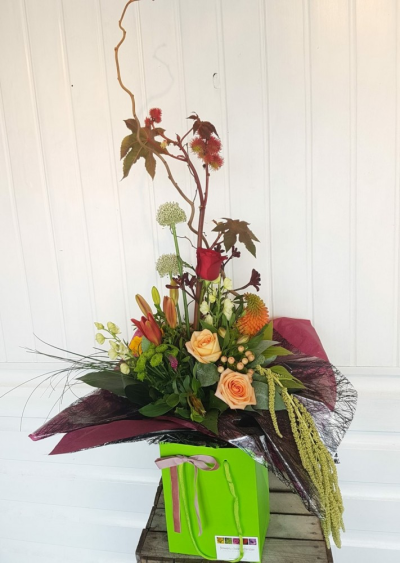 Beautiful Autumn - This stunning Autumnal arrangement, from the 'Fine & Dandy' collection at Flowers of Kidderminster, is perfect for any occasion or simply to decorate a hall way or reception area.

This structured arrangement of autumnal colour includes Amaranthus, Rose, Lily and various seasonal flowers. 

Emma has created the 'Fine & Dandy' collection of arrangement designs for when something truly stunning, beautiful and unique is required!

Created in the shop on Lisle Avenue with the freshest stems, Emma and her team will create this arrangement ready for collection or delivery.

Final arrangement may look different to the image and stems may be substituted when necessary but your arrangement will alway look stunning! The container is subject to availability and may be substituted.

Almost what you're after? We can tailor any bouquet to your needs and budget. Want to incorporate their favourite colours? Do you want to adapt the style to your needs and budget? All colours, styles and budgets can all be catered for.

Arrangements are available for same day delivery, when ordered before 2pm, in Kidderminster and the surrounding area. (Charges apply)