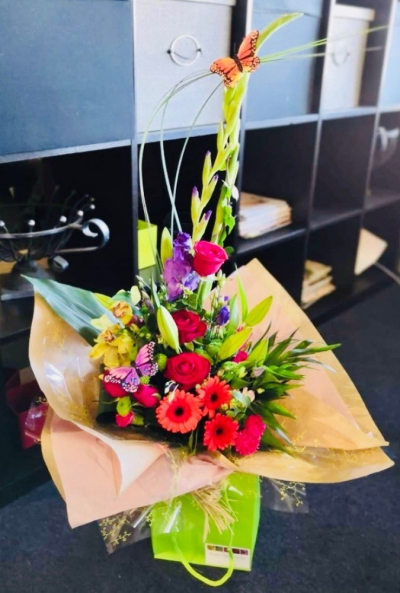 Cosmopolitan - A glorious mix of flowers in vibrant colours for Mother's Day. Includes Roses, Gerberas, Orchids and Lisianthus in a beautiful mix of red, pink, purple and green.

 

Emma has created the 'Fine & Dandy' collection of arrangement designs for when something truly stunning, beautiful and unique is required!

 

Created in the shop on Lisle Avenue with the freshest stems, Emma and her team will create this arrangement ready for collection or delivery (charges apply).

 

The final arrangement may look different to the image and stems may be substituted when necessary but your arrangement will always look stunning!

 

Almost what you're after? We can tailor any bouquet to your needs and budget. Want to incorporate their favourite colours? Do you want to adapt the style to your needs and budget? All colours, styles and budgets can all be catered for.

All flowers are subject to availability. Substitutes may be used but your bouquet will always look beautiful!

Order this item before 2 pm for same-day delivery by Flowers of Kidderminster in Kidderminster and surrounding areas.