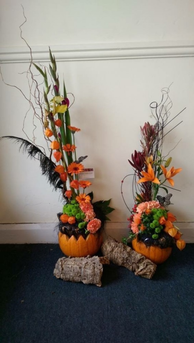Hey Pumpkin! - These fun Halloween arrangements, designed and created by Emma Dandy of Flowers of Kidderminster, are available from £30.

This orange and green celebration of Halloween would be a great addition to any goolish party! Includes seasonal stems and decoration.

Emma has created the 'Fine & Dandy' collection of arrangement designs for when something truly stunning, beautiful and unique is required!

Created in the shop on Lisle Avenue with the freshest stems, Emma and her team will create this arrangement ready for collection or delivery.

Final arrangement may look different to the image and stems may be substituted when necessary but your arrangement will alway look stunning! 

Almost what you're after? We can tailor any bouquet to your needs and budget. Want to incorporate their favourite colours? Do you want to adapt the style to your needs and budget? All colours, styles and budgets can all be catered for.

Arrangements are available for same day delivery, when ordered before 2pm, in Kidderminster and the surrounding area. (Charges apply)