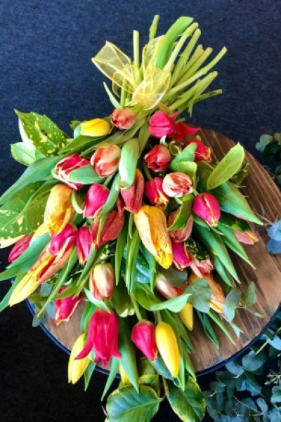 Funeral tribute Tulip flat hand tie - Sympathy flowers are a beautiful way to let someone know that you are thinking of them at a sad time.

This seasonal hand-tied bouquet of tulips is available each Spring.

Each bouquet is designed and created by professional, qualified, local florists, Emma and her team. The talented florists at Flowers of Kidderminster add a touch of style to every bouquet, which is put together by hand, from scratch.

Almost what you're after? We can tailor any bouquet to your needs and budget. Want to incorporate their favourite colours? Do you want to adapt the style to your needs and budget? All colours, styles and budgets can all be catered for.

All flowers are subject to availability. Substitutes may be used but your bouquet will always look beautiful!
