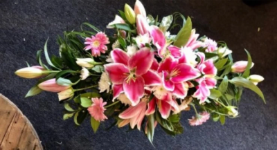 Small double ended lily spray - Beautiful small double-ended spray in pink lilies. 

Funeral Tributes which reflect the personality and the life of the person sadly departed are created with care and attention by our team of qualified, professional and local florists.

This traditional double ended spray is made-up in the florists' selection of pink lilies and other pink and white stems.

Each tribute is designed and created by professional, qualified, local florists, Emma and her team. The talented florists at Flowers of Kidderminster create every arrangement by hand and from scratch.

Almost what you're after? We tailor all funeral tributes to your specific requirements. We can incorporate their favourite colours or create a style that reflects their personality. Call us to talk about what you would like and we will create it for you.

All flowers are subject to availability. Substitutes may be used but your tribute will always look beautiful!

Funeral Tributes can be delivered on the day to a location of your choice.
