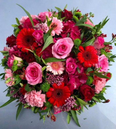 Funeral Flat Posy in Red and Pink - Sympathy flowers are a beautiful way to let someone know that you are thinking of them at a sad time.

This flat posy includes pink and red gerberas and roses set within delicate foliage. 

Each tribute is designed and created by professional, qualified, local florists, Emma and her team. At this difficult time, they are here to help make choosing and ordering funeral flowers and sympathy tributes a little easier.

Almost what you're after? We can tailor your tribute to suit your needs and budget. Want to incorporate their favourite colours? All colours, styles and budgets can all be catered for.

All flowers are subject to availability. Substitutes may be used but your tribute will always look beautiful!

Order by 2pm for same day delivery. Also available to order for a day of your choice.