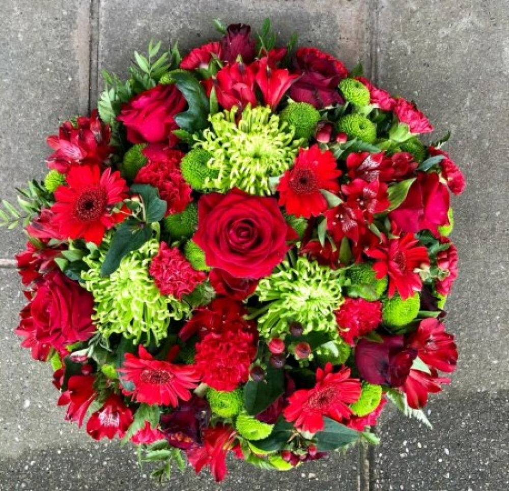 Funeral flat posy in red and green