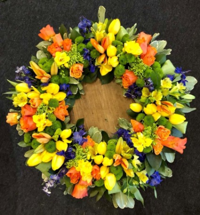 Spring wreath - Funeral Tributes which reflect the personality and the life of the person sadly departed are created with care and attention by our team of qualified, professional and local florists.

This Springtime seasonal Wreath, can be ordered in 16" or 20" and is a made up in the florists' selection of spring flower stems.

Please state in your order notes if you would like different colours from those shown in the picture.

Each tribute is designed and created by professional, qualified, local florists, Emma and her team. The talented florists at Flowers of Kidderminster add a touch of style to every bouquet, which is put together by hand, from scratch.

Almost what you're after? We tailor all funeral tributes to your specific requirements. We can incorporate their favourite colours or create a style that reflects their personality. Come in and talk to us about what you would like and we will create it for you.

All flowers are subject to availability. Substitutes may be used but your tribute will always look beautiful!

Funeral Tributes can be delivered on the day to a location of your choice.