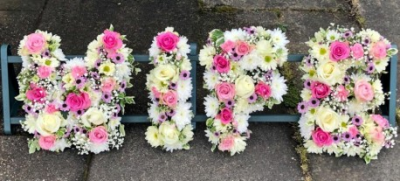 4 Letter Funeral Spray - This 4 Letter Funeral Spray is made-up in the florist's selection of fresh blooms in the customers choice of flowers and colours. 

Letters can spell out a four-letter word or name. Other length word sprays are also available. Please call us to discuss.

Funeral Tributes are created with care and attention by our team of qualified, professional and local florists Emma and her team.

Almost what you're after? We tailor all funeral tributes to your specific requirements. We can incorporate their favourite colours or create a style that reflects their personality. Call us to talk about what you would like and we will create it for you.

All flowers are subject to availability. Substitutes may be used but your tribute will always look beautiful!

Funeral Tributes can be delivered on the day to a location of your choice.