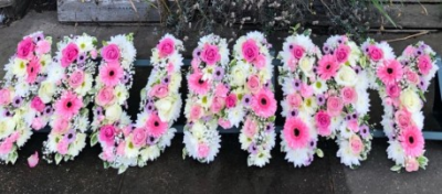 5 Letter Word Funeral Spray - This 5 Letter Funeral Spray is made-up in the florist's selection of fresh blooms in the customers choice of flowers and colours. 

Letters can spell out a five-letter word or name. Other length word sprays are also available. Please call us to discuss.

Funeral Tributes are created with care and attention by our team of qualified, professional and local florists Emma and her team.

Almost what you're after? We tailor all funeral tributes to your specific requirements. We can incorporate their favourite colours or create a style that reflects their personality. Call us to talk about what you would like and we will create it for you.

All flowers are subject to availability. Substitutes may be used but your tribute will always look beautiful!

Funeral Tributes can be delivered on the day to a location of your choice.