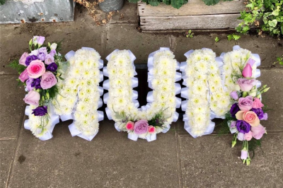 3 Letter Funeral Spray - This 3 Letter Funeral Spray is made-up in the florist's selection of white blooms with sprays in the customers choice of colour. 

Letters can spell out a three-letter "Mum", "Mom", "Nan", "Dad". Longer word sprays are also available. Please call us to discuss.

Funeral Tributes are created with care and attention by our team of qualified, professional and local florists Emma and her team.

Almost what you're after? We tailor all funeral tributes to your specific requirements. We can incorporate their favourite colours or create a style that reflects their personality. Call us to talk about what you would like and we will create it for you.

All flowers are subject to availability. Substitutes may be used but your tribute will always look beautiful!

Funeral Tributes can be delivered on the day to a location of your choice.