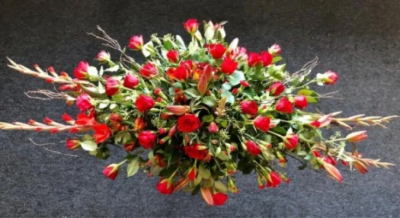 All Red Coffin Spray - All red, double ended 3ft spray in oasis.

Funeral Tributes which reflect the personality and the life of the person sadly departed are created with care and attention by our team of qualified, professional and local florists.

This 3ft double ended spray is a made up in the florists' selection of red stems including Roses and Carnations against green foliage.

Each tribute is designed and expertly prepared by professional, locally based, florists Emma and Laura. At this difficult time, Emma and her team are here to help choosing and ordering funeral flowers and sympathy tributes a little easier.

All arrangements are created from our collection of fresh flowers at our shop in Lisle Avenue, Kidderminster.

Almost what you're after? We tailor all funeral tributes to your specific requirements. We can incorporate their favourite colours or create a style that reflects their personality. Come in and talk to us about what you would like and we will create it for you.

All flowers are subject to availability. Substitutes may be used but your tribute will always look beautiful!

Funeral Tributes can be delivered on the day to a location of your choice.