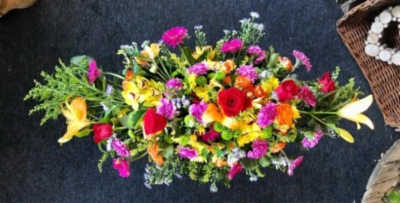 Vibrant Double-ended Spray - This 2ft vibrant, double-ended spray is made up in the florists' selection of colourful stems including Orchids, Roses, Lilies, Gerberas and Carnations against green foliage.

Funeral Tributes which reflect the personality and the life of the person sadly departed are created with care and attention by our team of qualified, professional and local florists.

Express condolences and pay tribute with this spray, expertly prepared by professional, locally based, florists Emma and Laura. At this difficult time, Emma and her team are here to help make choosing and ordering funeral flowers and sympathy tributes a little easier.

All arrangements are created from our collection of fresh flowers at our shop in Lisle Avenue, Kidderminster. 

Almost what you're after? We tailor all funeral tributes to your specific requirements. We can incorporate their favourite colours or create a style that reflects their personality. Come in and talk to us about what you would like and we will create it for you.

All flowers are subject to availability. Substitutes may be used but your tribute will always look beautiful!

Funeral Tributes can be delivered on the day to a location of your choice.