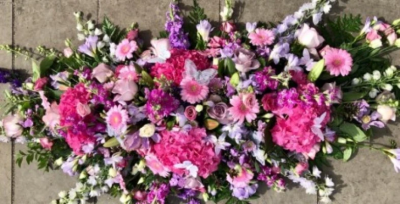 Butterfly Coffin Spray - This beautiful pink and lilac coffin spray consists of florist selected fresh stems including roses, hydrangeas, gerberas and freesias adorned with silver butterflies.

This double ended spray comes in a variety of lengths; 4ft, 5ft, 6ft.  

Express condolences and pay tribute with this spray, expertly prepared by professional, locally based, florists Emma and Laura. At this difficult time, Emma and her team are here to help make choosing and ordering funeral flowers and sympathy tributes a little easier.

All arrangements are created from our collection of fresh flowers at our shop in Lisle Avenue, Kidderminster.

 

Can't find the perfect tribute? All arrangements can be designed for your specific requirements and budget. All colours, styles and budgets can be catered for. Please contact us to discuss any specific requirements.

Matching double ended sprays, wreaths, posies, sheafs and hearts also available.

Variations from the image may be necessary but will always be beautifully designed and crafted.

This spray is available for delivery in Kidderminster and surrounding areas.