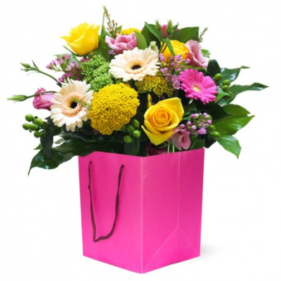 Sugar Pop - A burst of pink and yellow spring colours is presented in this hand tied bouquet in a bag. 

A wondeful mix of colours and styles set within lush green foliage is a perfect gift for any happy occasion! Containing Gerberas, Roses, Lisianthus, Achillea and Wax Flower.