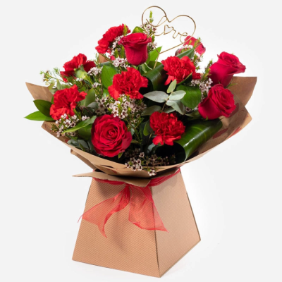 Smooch - Roses and carnations make the perfect couple in this timeless and romantic gift that's sure to impress.