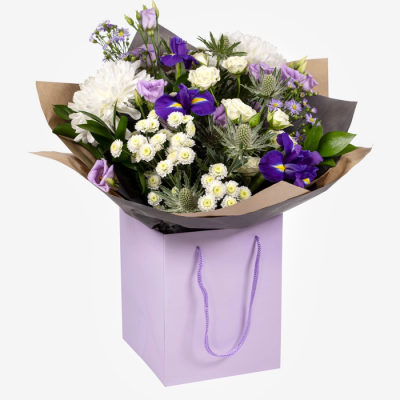 Violet - An elegant hand-tied of purple and white blooms, presented in a lilac gift bag to make your gesture feel extra special