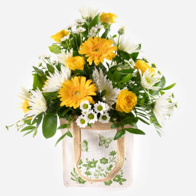 Lemon drops - Bursting with sunshine tones, this cheerful jute bag of blooms is a joyful way to show you care.