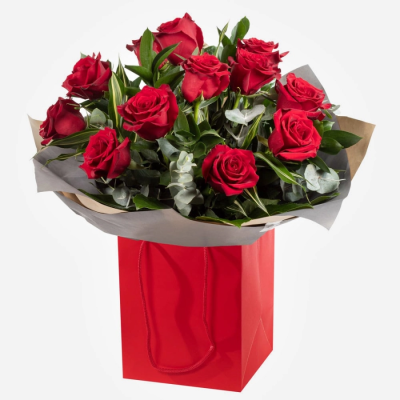 For my sweetheart - 12 luxury red roses and lush foliage — the ultimate romantic gesture.