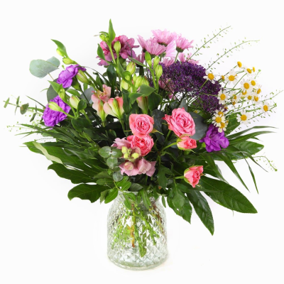 Wild Blossom - A petite vase arrangement that captures the carefree beauty of a summer meadow. Wild Blossom blends soft, harmonious tones with fresh greenery to create a design that feels natural, joyful, and effortlessly uplifting.