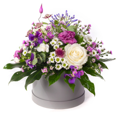 Purple Haze - A jewel-toned beauty with a modern twist. Purple Haze combines soft whites with rich shades of purple and lilac, creating a striking contrast that feels both elegant and uplifting. Presented in a stylish hatbox, it’s a chic design full of colour, texture, and charm.